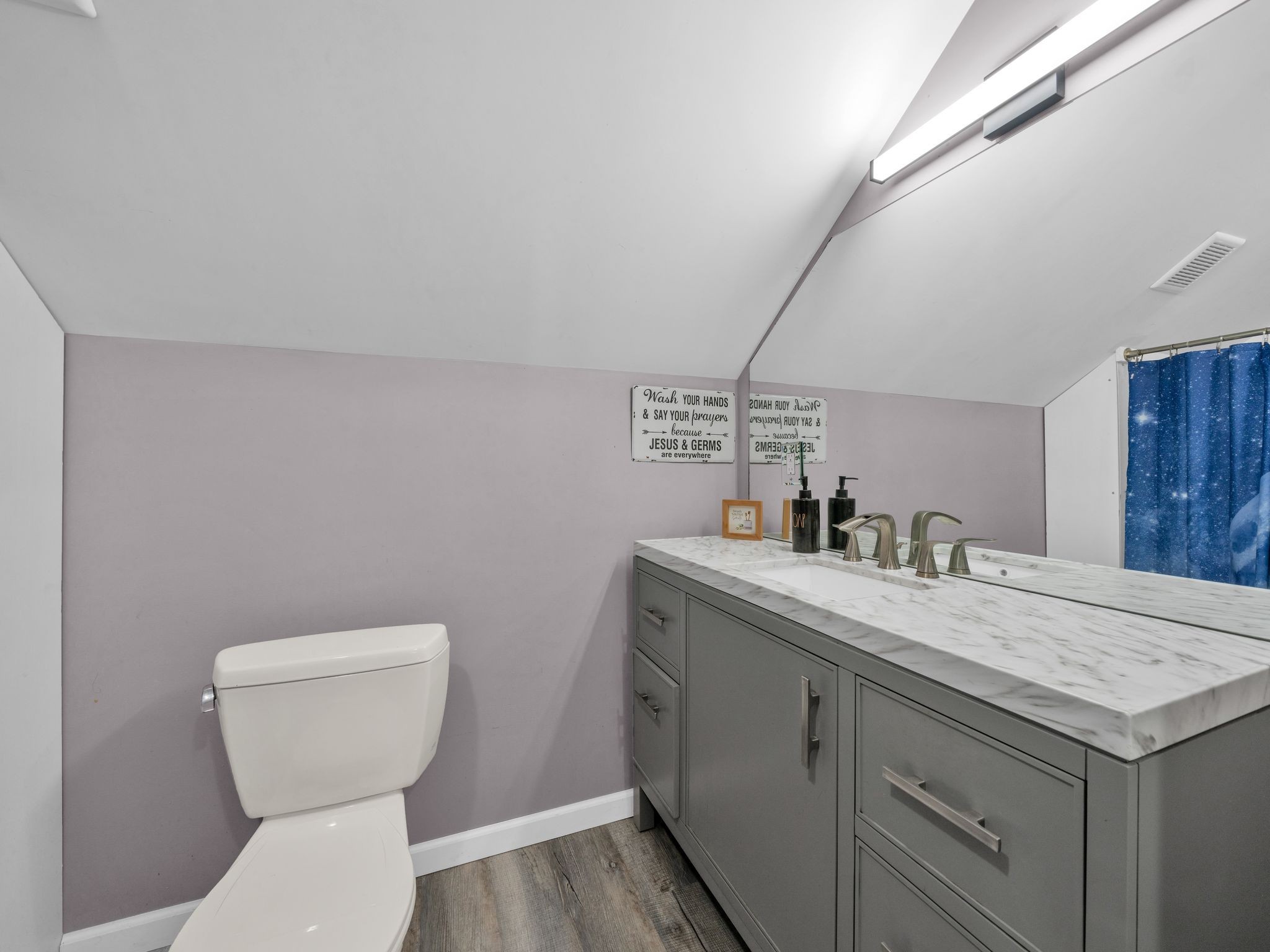 509 Iron Hill Road Burns, TN 37029 - Photo 32 of 40 a bathroom with a toilet sink and mirror