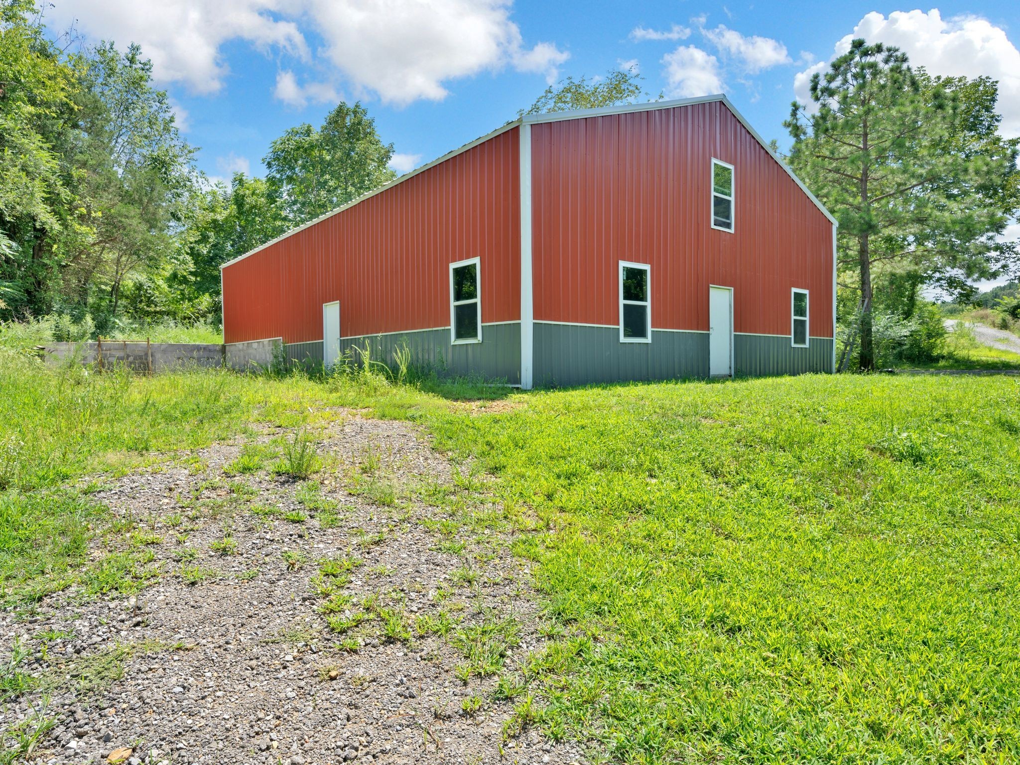 509 Iron Hill Road Burns, TN 37029 - Photo 35 of 40 a house view with garden space and trees