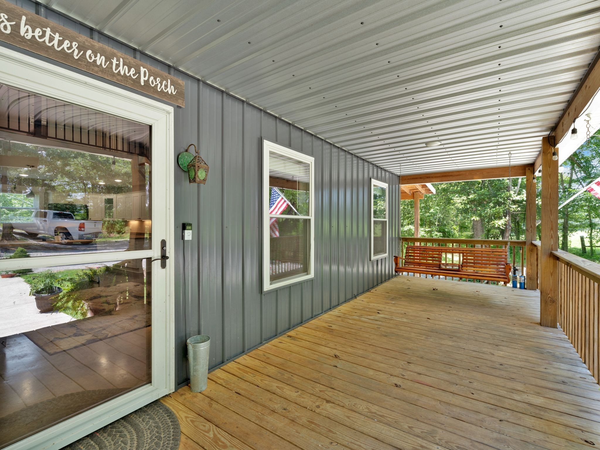 509 Iron Hill Road Burns, TN 37029 - Photo 10 of 40 a view of porch with wooden floor and floor to ceiling window