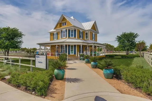 a living room with furniture a fireplace and a table