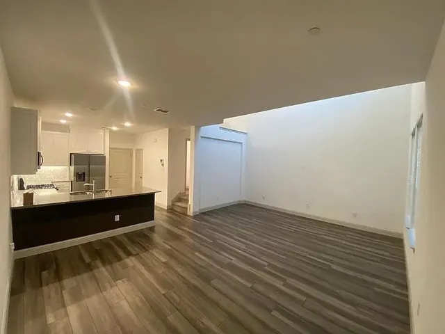 a view of kitchen with wooden floor