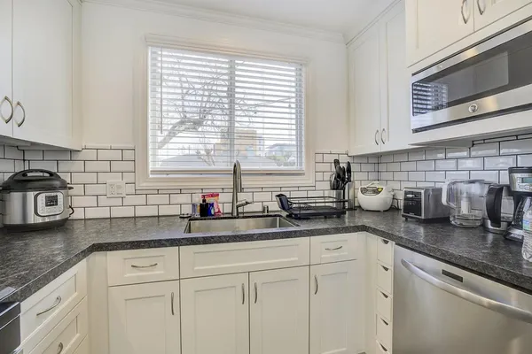 a bathroom with a sink toilet and vanity