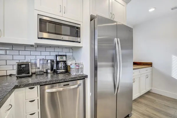 a bedroom with a bed and a ceiling fan