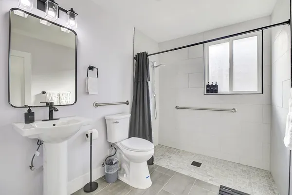 a view of a livingroom with furniture and wooden floor