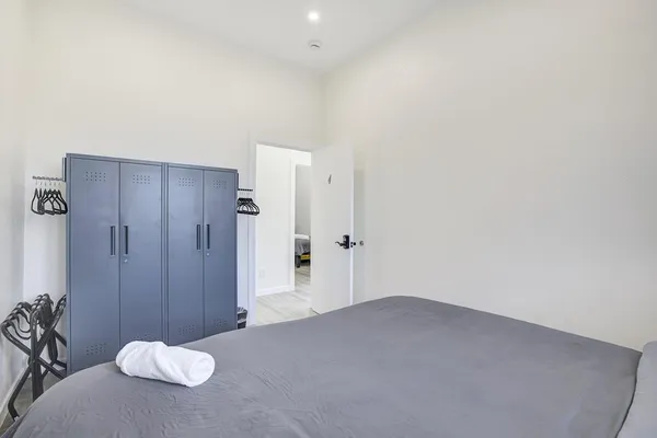 a view of a patio with table and chairs with wooden fence