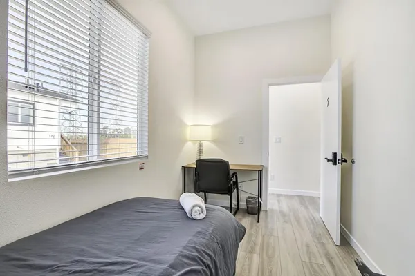 a living room with furniture fireplace and window