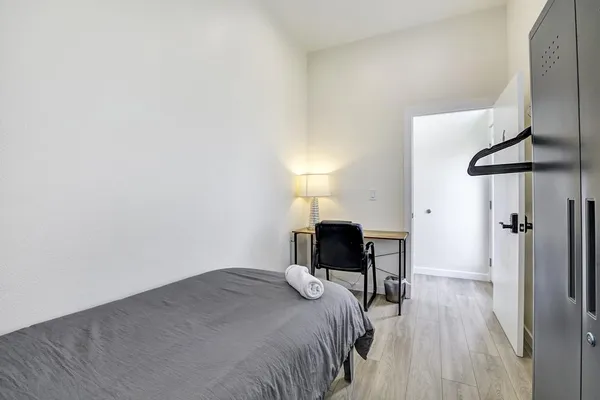 a living room with furniture and kitchen view