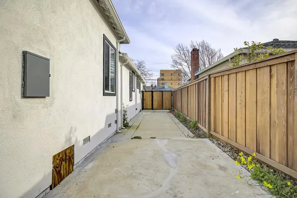 a bathroom with a sink a toilet a mirror and shower