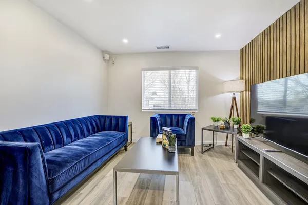 a bedroom with a bed and a table in it