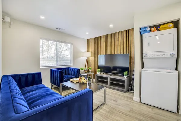 a front view of a house with a wooden fence