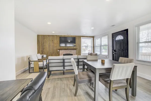 a view of a dining room with furniture window and wooden floor