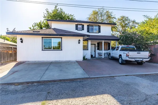 a view of a car park in front of a house