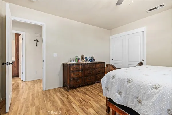 a bathroom with a granite countertop sink a toilet a mirror and shower