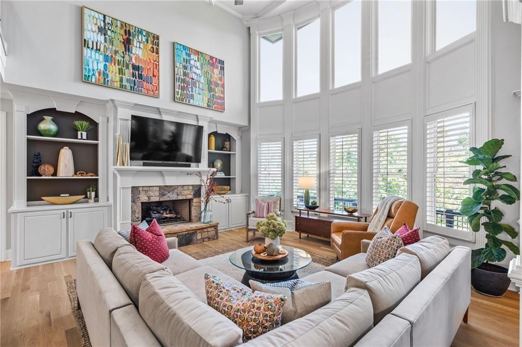 4526 Meadowland Way Flowery Branch, GA 30542 - Photo 17 of 64 a living room with furniture fireplace and flat screen tv