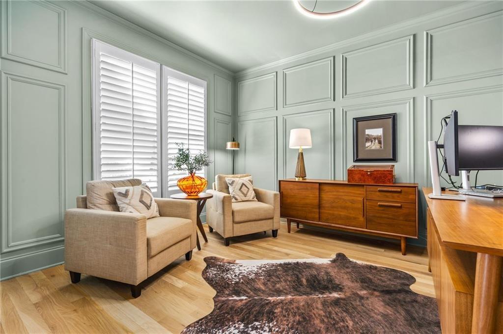 4526 Meadowland Way Flowery Branch, GA 30542 - Photo 20 of 64 a living room with furniture and a flat screen tv