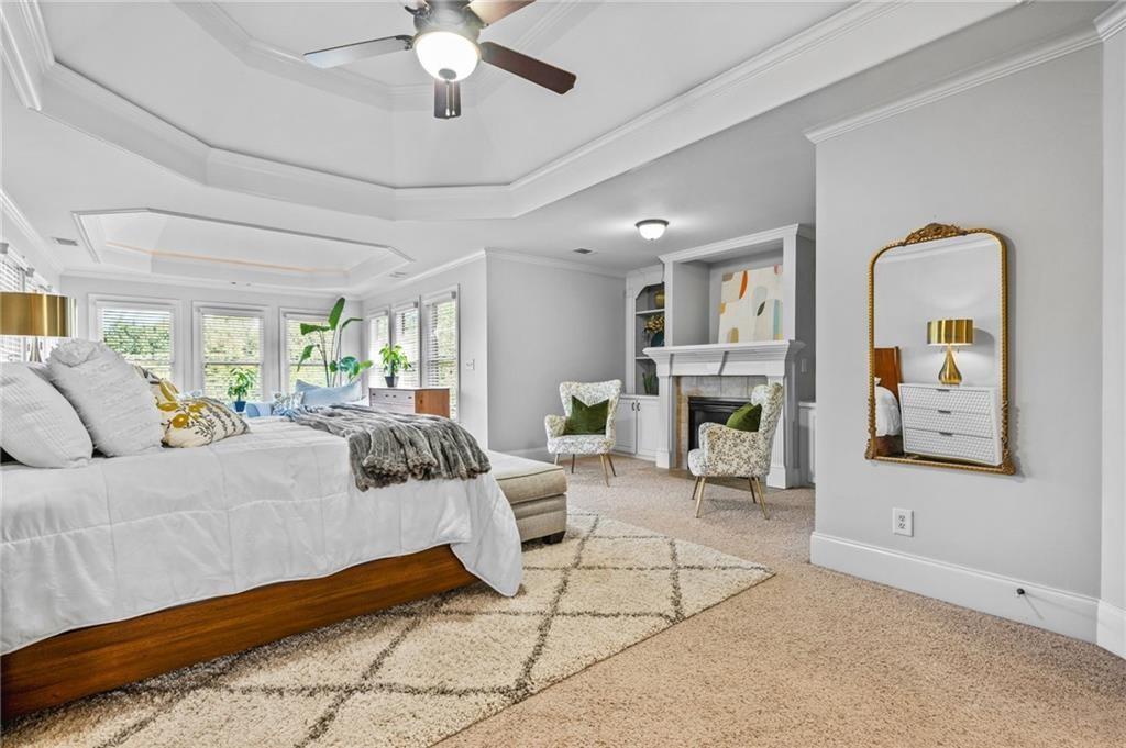 4526 Meadowland Way Flowery Branch, GA 30542 - Photo 23 of 64 a bedroom with a bed couch and a window