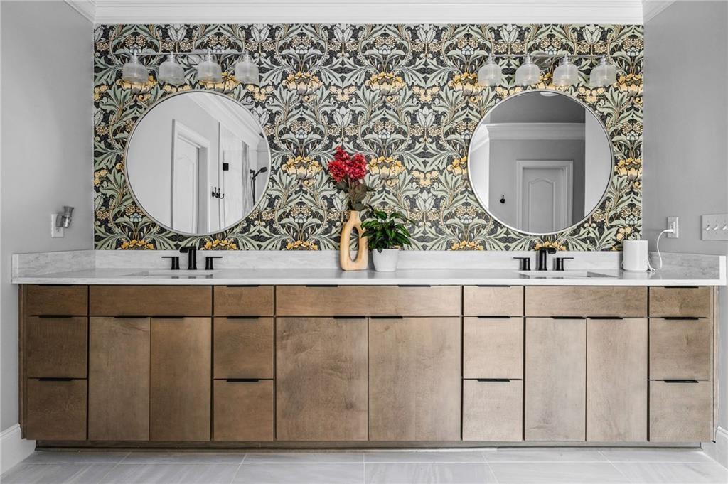 4526 Meadowland Way Flowery Branch, GA 30542 - Photo 30 of 64 a bathroom with a sink mirror and vanity