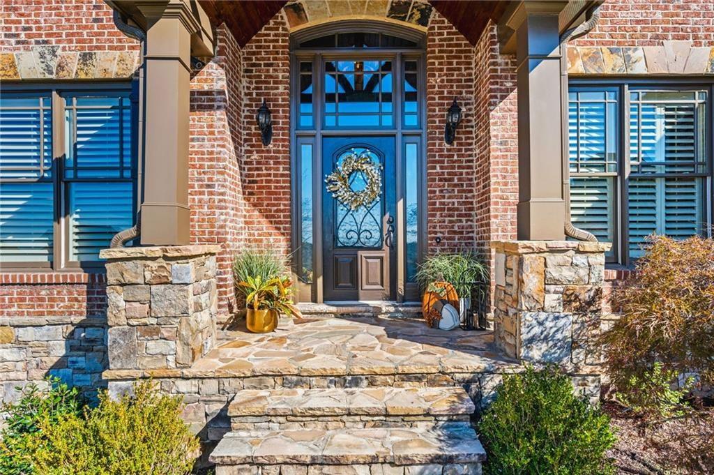 4526 Meadowland Way Flowery Branch, GA 30542 - Photo 3 of 64 a view of a building with potted plants