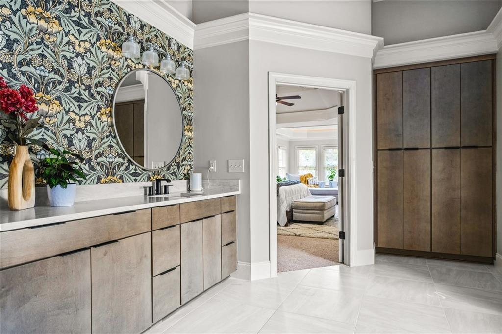 4526 Meadowland Way Flowery Branch, GA 30542 - Photo 31 of 64 a en suite bathroom with a double vanity sink and a mirror