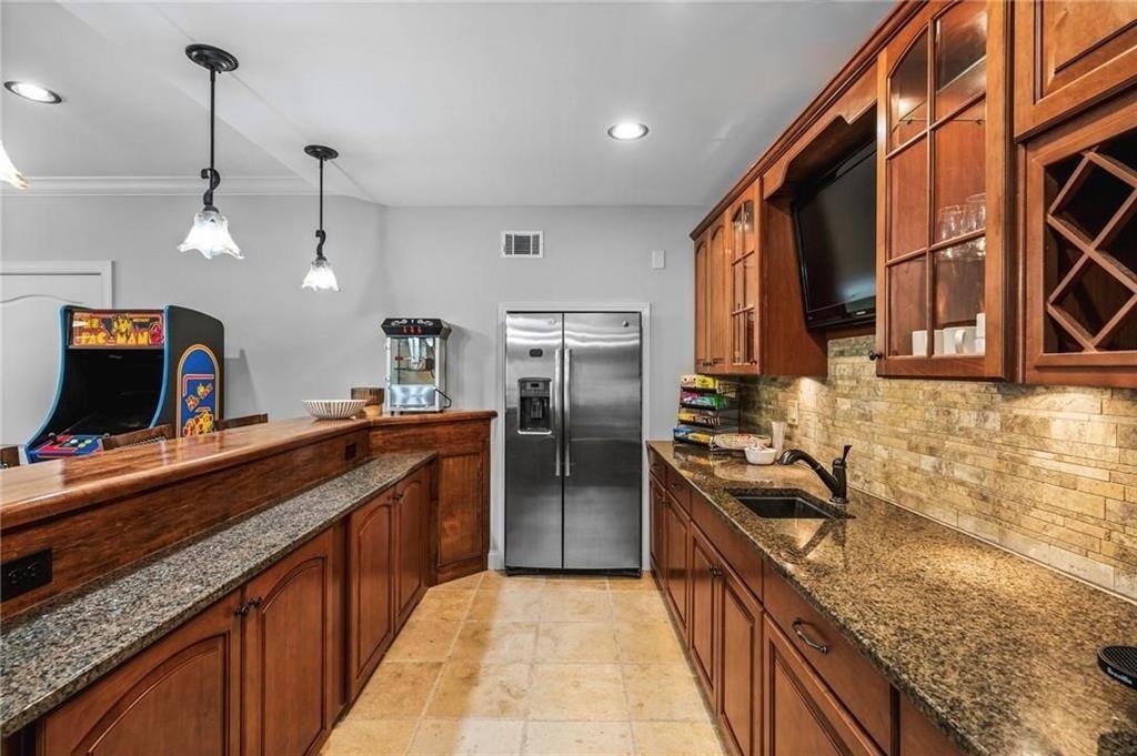 4526 Meadowland Way Flowery Branch, GA 30542 - Photo 40 of 64 a kitchen with stainless steel appliances granite countertop a sink and stove