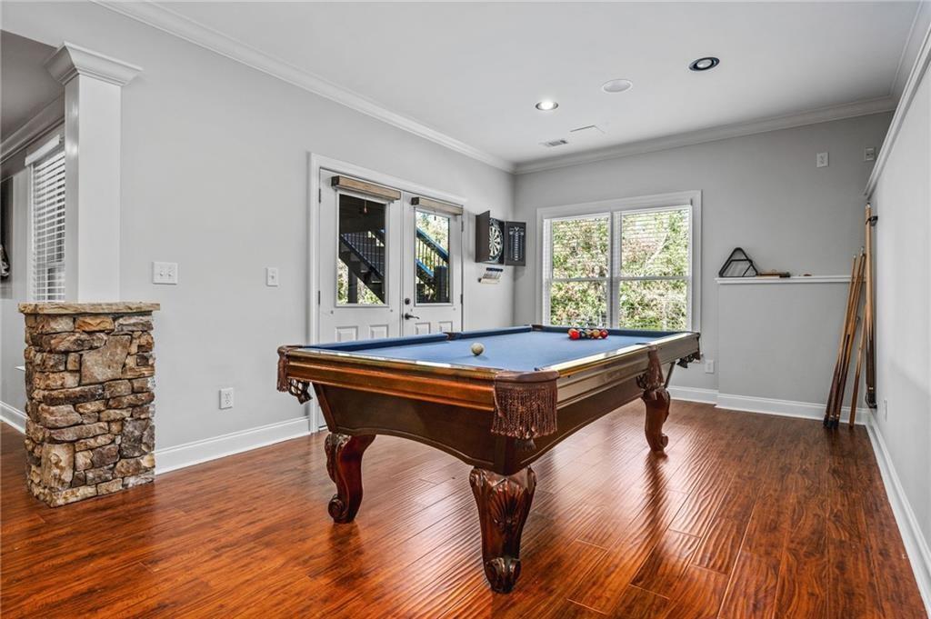 4526 Meadowland Way Flowery Branch, GA 30542 - Photo 44 of 64 a room with pool table and windows