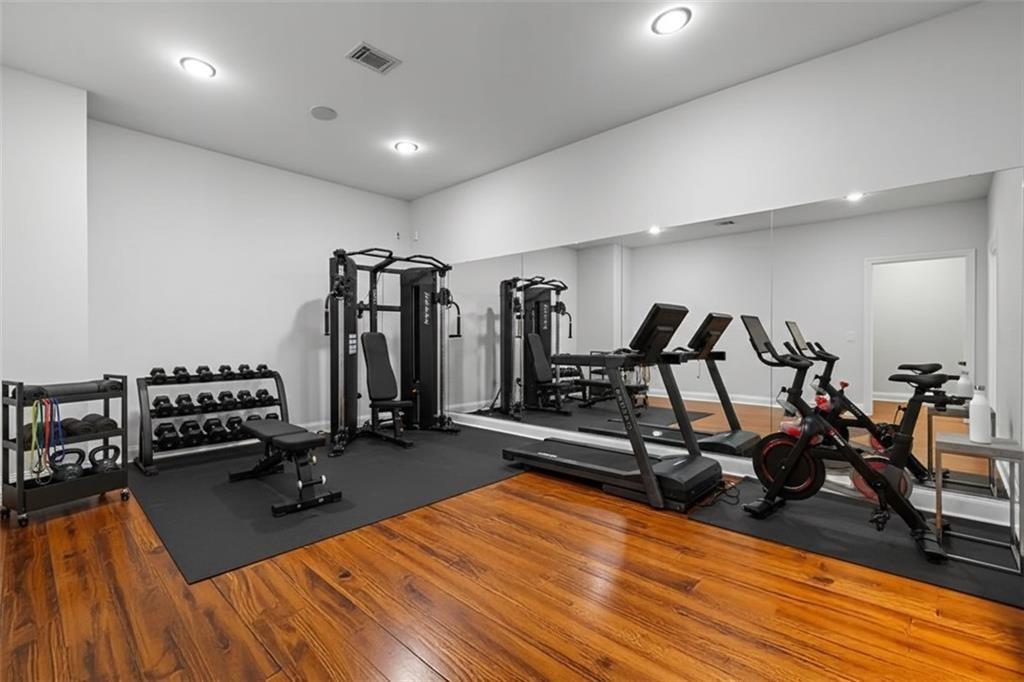 4526 Meadowland Way Flowery Branch, GA 30542 - Photo 45 of 64 a view of a room with gym equipment