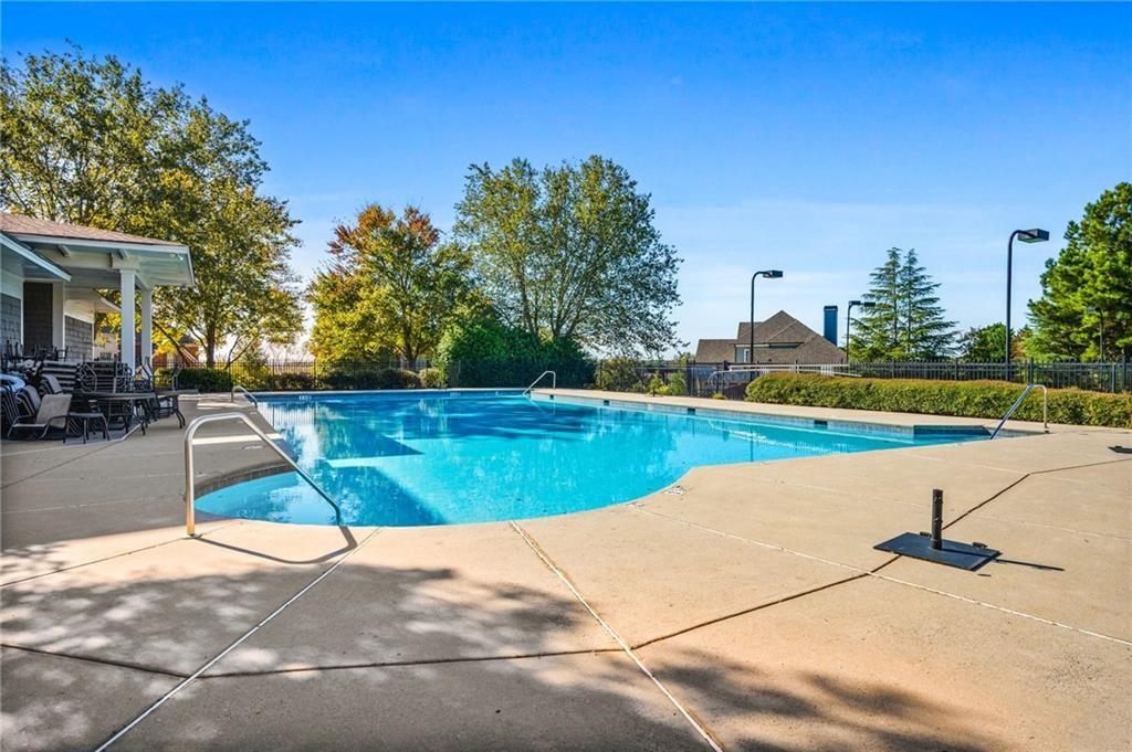 4526 Meadowland Way Flowery Branch, GA 30542 - Photo 62 of 64 a view of a swimming pool and a yard