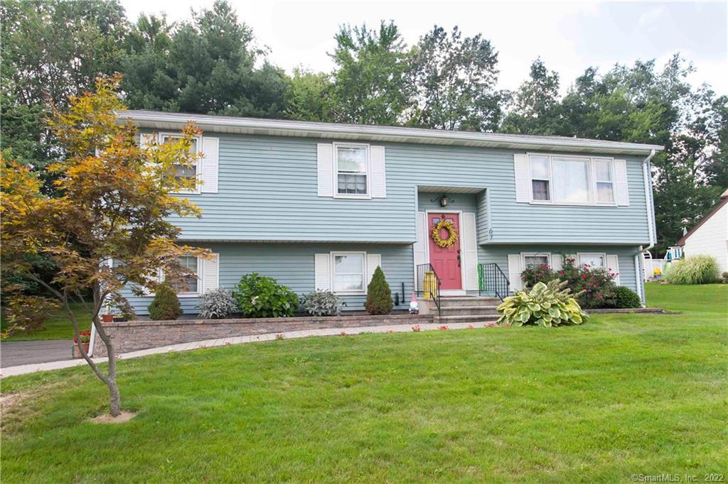 67 Violet Drive Bristol, CT 06010 - Photo 1 of 1 a front view of a house with garden