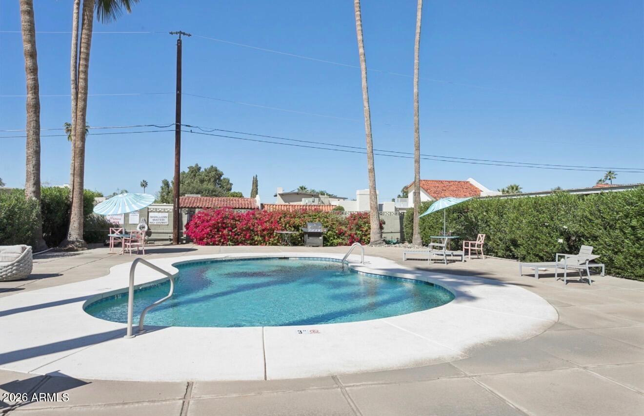 1030 East Bethany Home Road, Unit 6 Phoenix, AZ 85014 - Photo 11 of 15 a view of a road with a building in the background