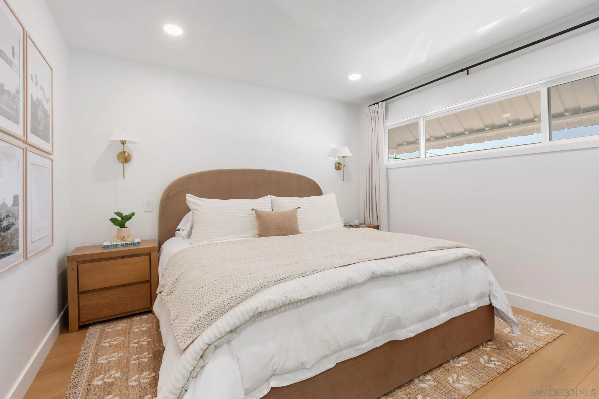 210 A Street, Unit 2 Encinitas, CA 92024 - Photo 13 of 44 a bedroom with a bed and a window