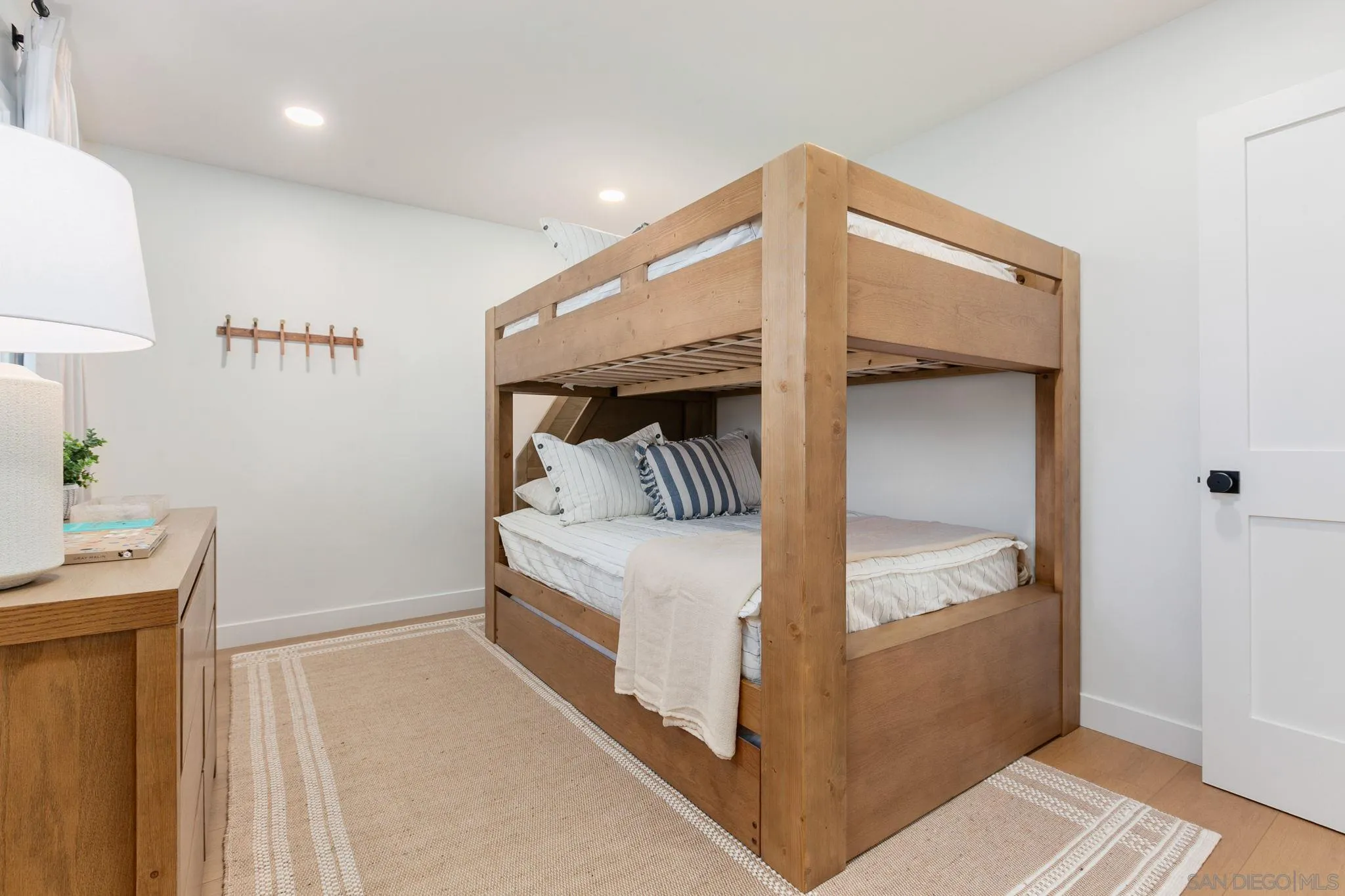 210 A Street, Unit 2 Encinitas, CA 92024 - Photo 17 of 44 a bedroom with a bed and a table