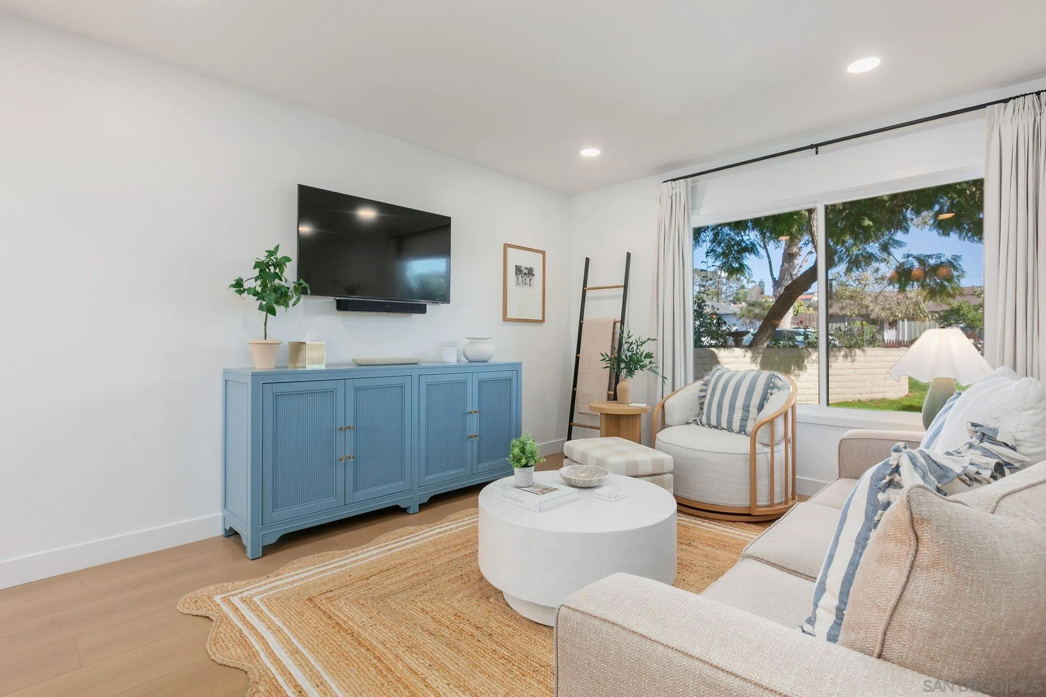 210 A Street, Unit 2 Encinitas, CA 92024 - Photo 3 of 44 a living room with furniture and a flat screen tv