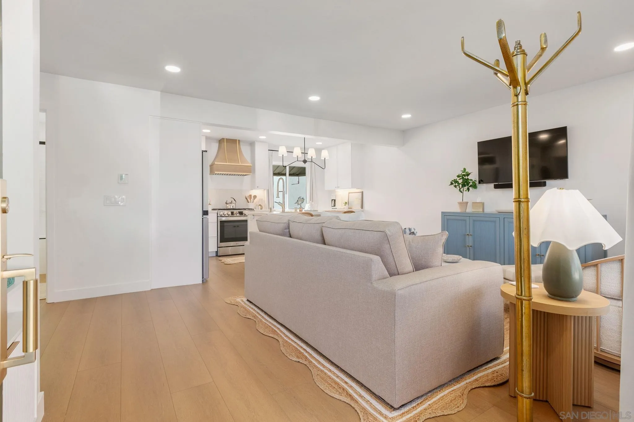210 A Street, Unit 2 Encinitas, CA 92024 - Photo 4 of 44 a living room with furniture and a flat screen tv