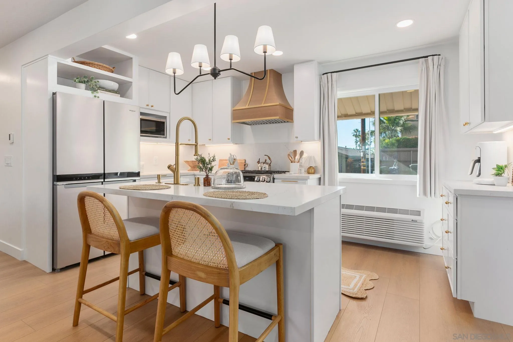 210 A Street, Unit 2 Encinitas, CA 92024 - Photo 7 of 44 a kitchen with stainless steel appliances granite countertop a sink a stove a refrigerator and island