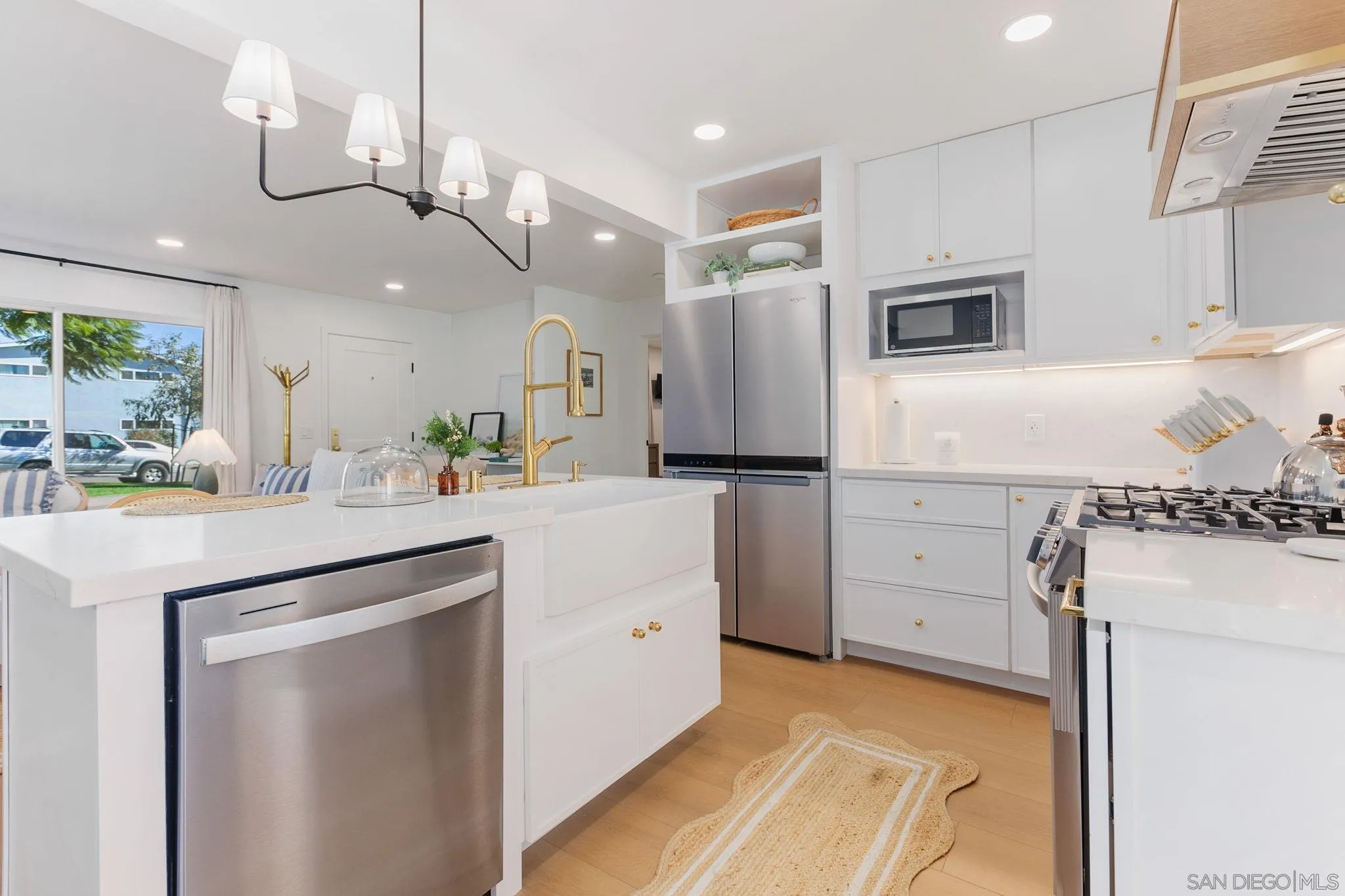 210 A Street, Unit 2 Encinitas, CA 92024 - Photo 10 of 44 a kitchen with kitchen island a counter top space appliances and cabinets