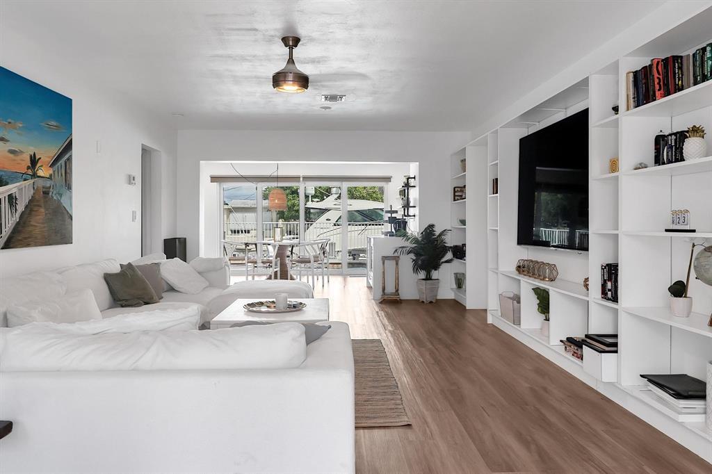 2233 Southeast 15th Street Pompano Beach, FL 33062 - Photo 14 of 53 a living room with furniture fireplace and flat screen tv