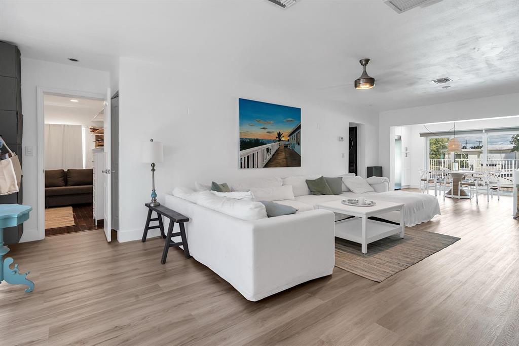 2233 Southeast 15th Street Pompano Beach, FL 33062 - Photo 18 of 53 a living room with furniture and a wooden floor