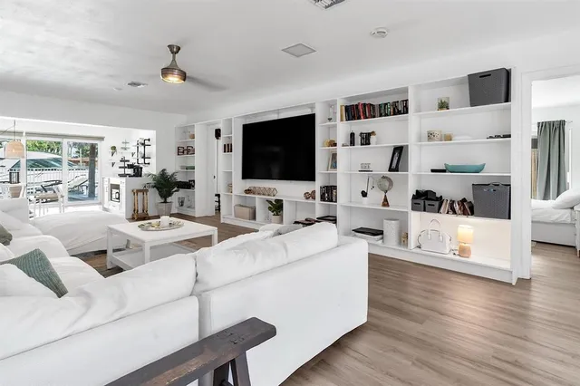 a living room with fireplace furniture and a flat screen tv