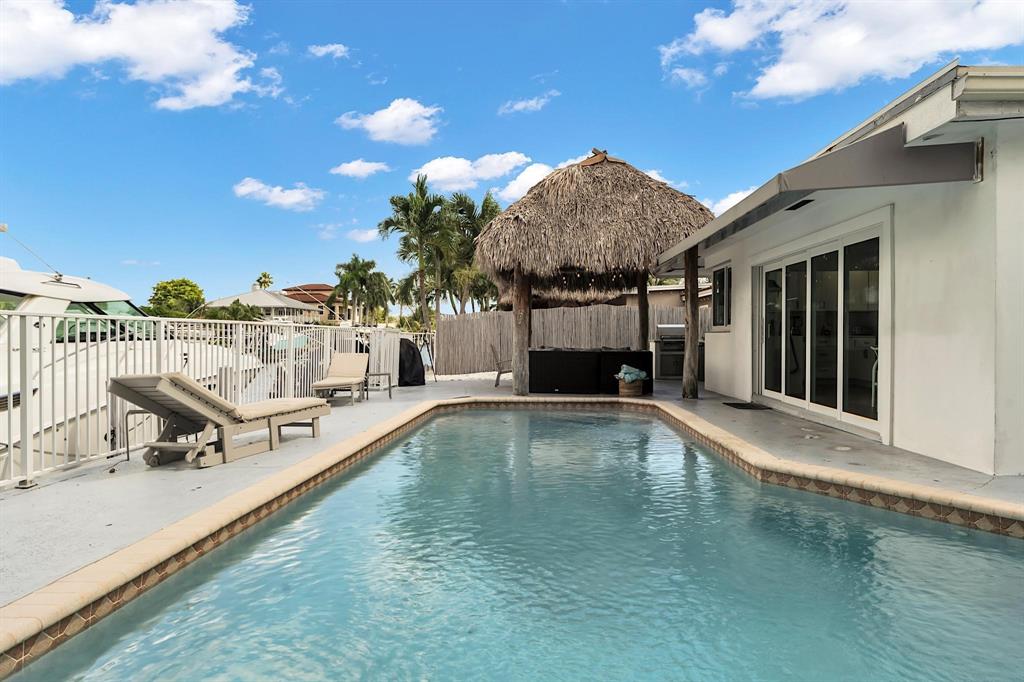 2233 Southeast 15th Street Pompano Beach, FL 33062 - Photo 2 of 53 a view of a house with backyard porch and sitting area