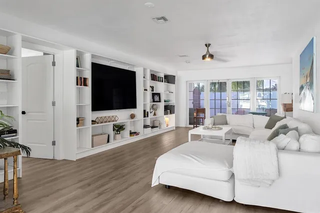 a kitchen with white cabinets and white appliances