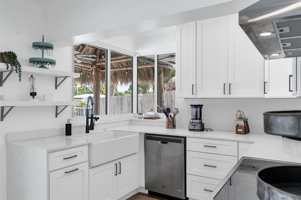 2233 Southeast 15th Street Pompano Beach, FL 33062 - Photo 31 of 53 a kitchen with a sink and cabinets