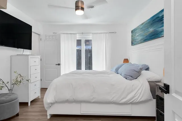 a bedroom with a bed and a view of bathroom