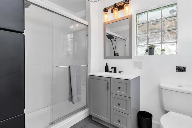 a view of bedroom and bedroom with wooden floor