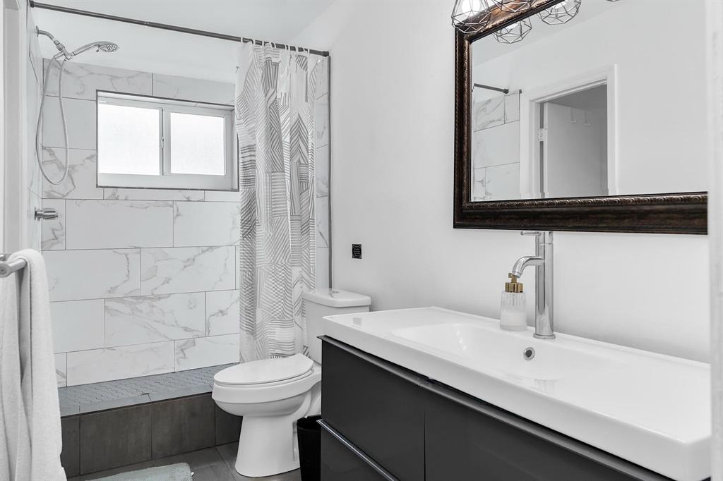 2233 Southeast 15th Street Pompano Beach, FL 33062 - Photo 39 of 53 a bathroom with a sink a toilet and shower