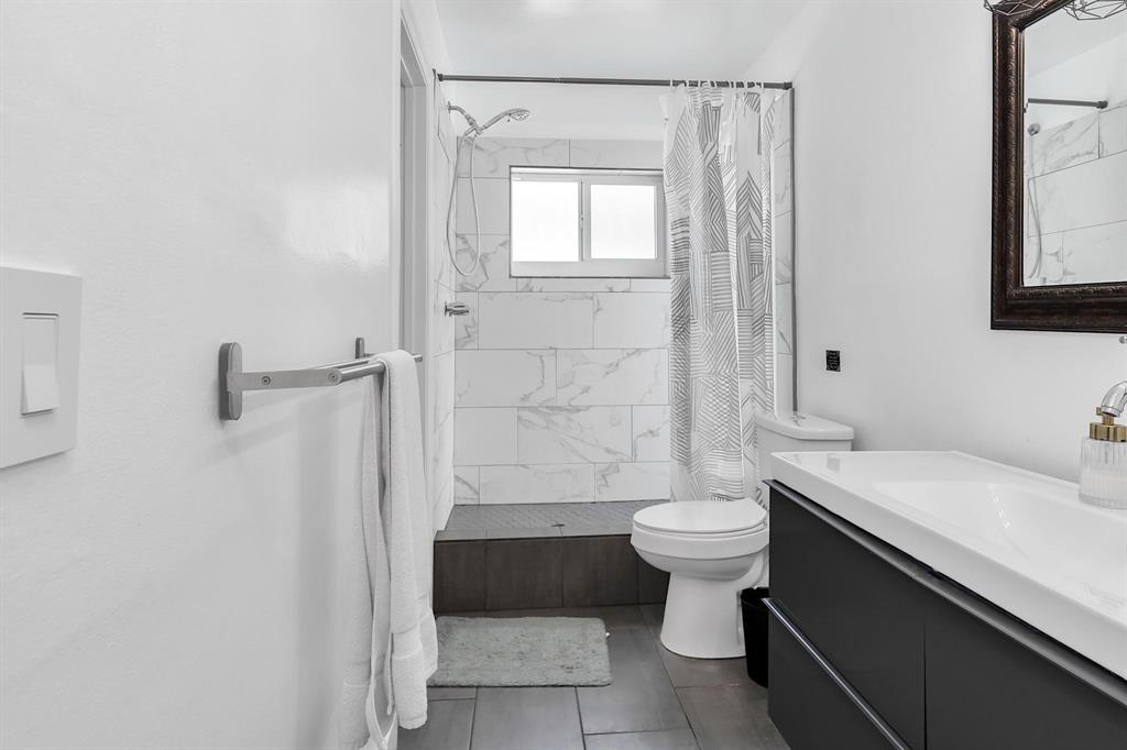 2233 Southeast 15th Street Pompano Beach, FL 33062 - Photo 40 of 53 a bathroom with a sink a toilet and shower