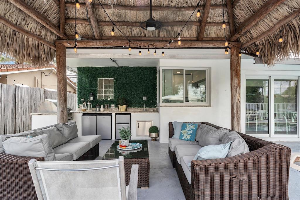 2233 Southeast 15th Street Pompano Beach, FL 33062 - Photo 4 of 53 a living room with furniture and a fireplace