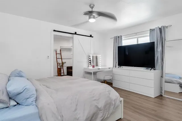 a front view of a house with a yard garage and outdoor seating