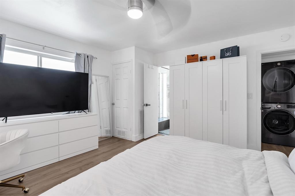 2233 Southeast 15th Street Pompano Beach, FL 33062 - Photo 47 of 53 a bedroom with a bed and a flat screen tv