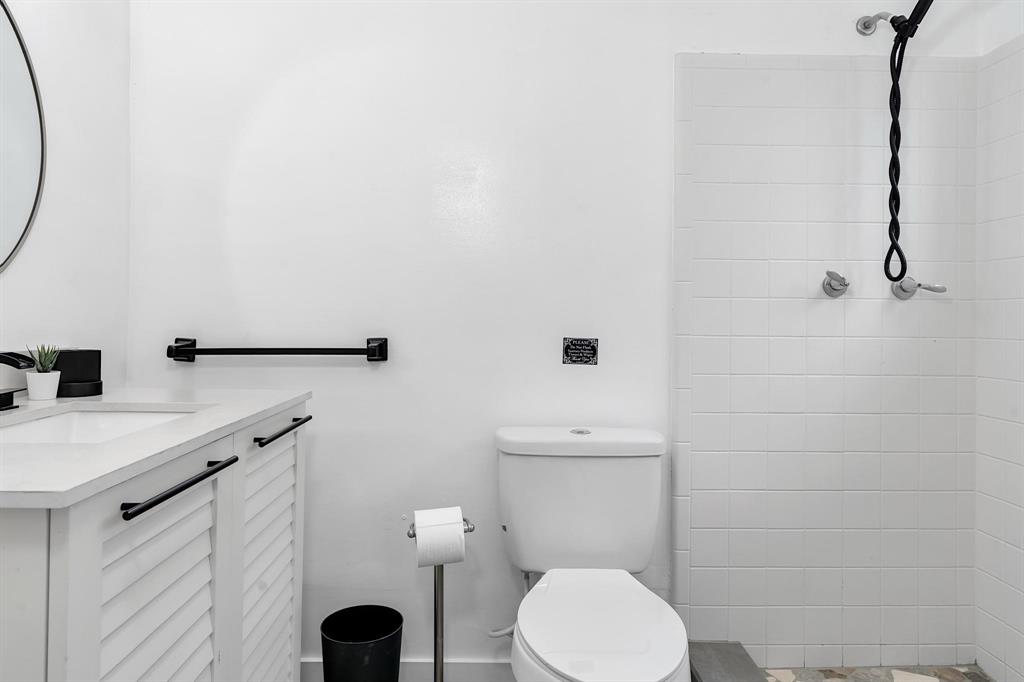 2233 Southeast 15th Street Pompano Beach, FL 33062 - Photo 49 of 53 a bathroom with a toilet sink and mirror