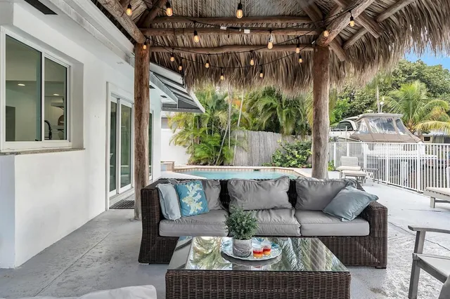 a view of a patio with couches chairs and a fire pit